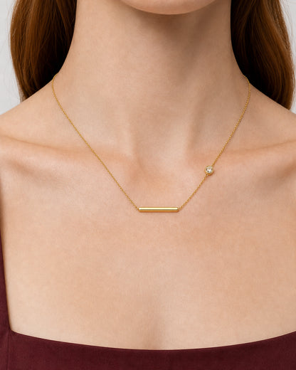 Complete true worn macro of the Aven bar and offset zircon station necklace