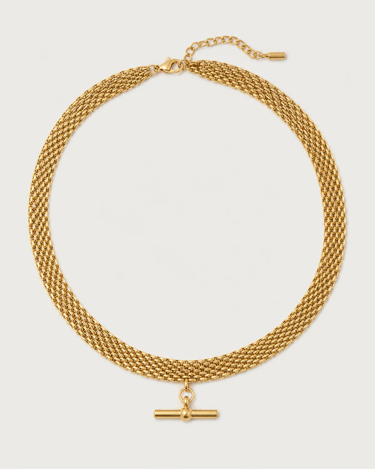 Camille gold five-row T-bar collar on a pale dove-grey background