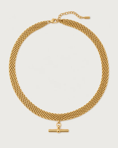 Camille gold five-row T-bar collar on a pale dove-grey background