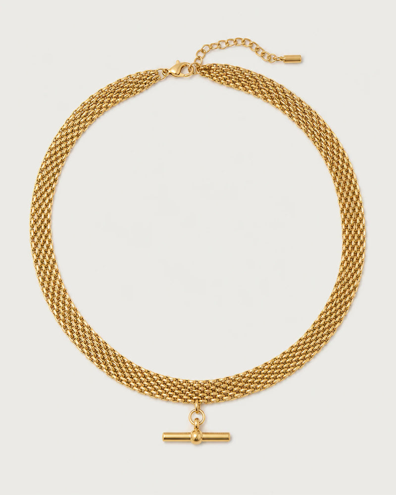 Camille gold five-row T-bar collar on a pale dove-grey background