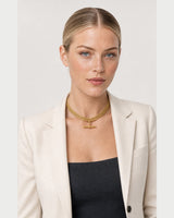 American model wearing the Camille five-row T-bar collar with an ivory blazer