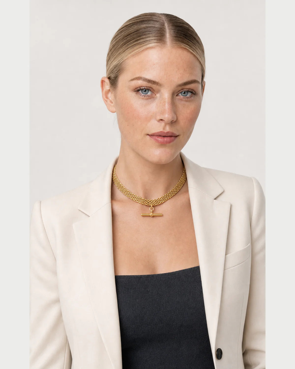 American model wearing the Camille five-row T-bar collar with an ivory blazer