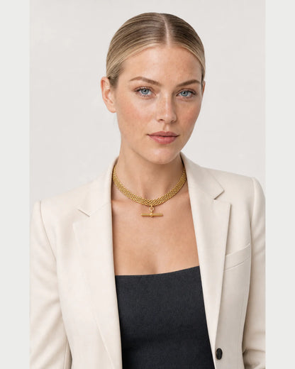 American model wearing the Camille five-row T-bar collar with an ivory blazer