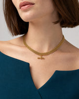 Front mouth-down wearing view of the Camille five-row T-bar collar with ink-teal tailoring