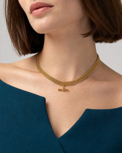 Front mouth-down wearing view of the Camille five-row T-bar collar with ink-teal tailoring