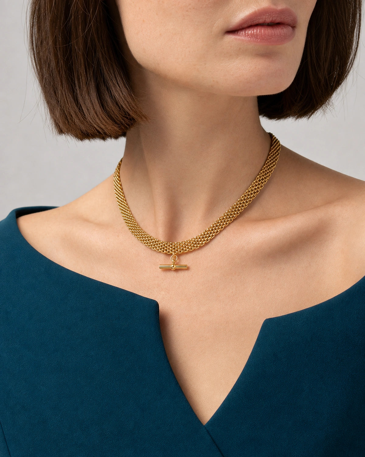 Three-quarter mouth-down wearing view of the Camille gold five-row collar