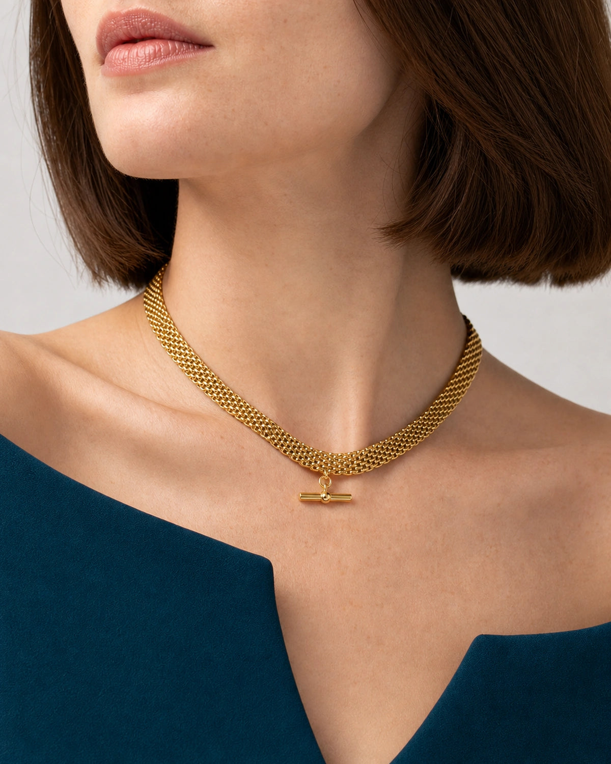 Jewellery-led worn detail of Camille's five link rows and horizontal T-bar
