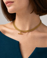 Alternate close worn view of the Camille five-row gold collar