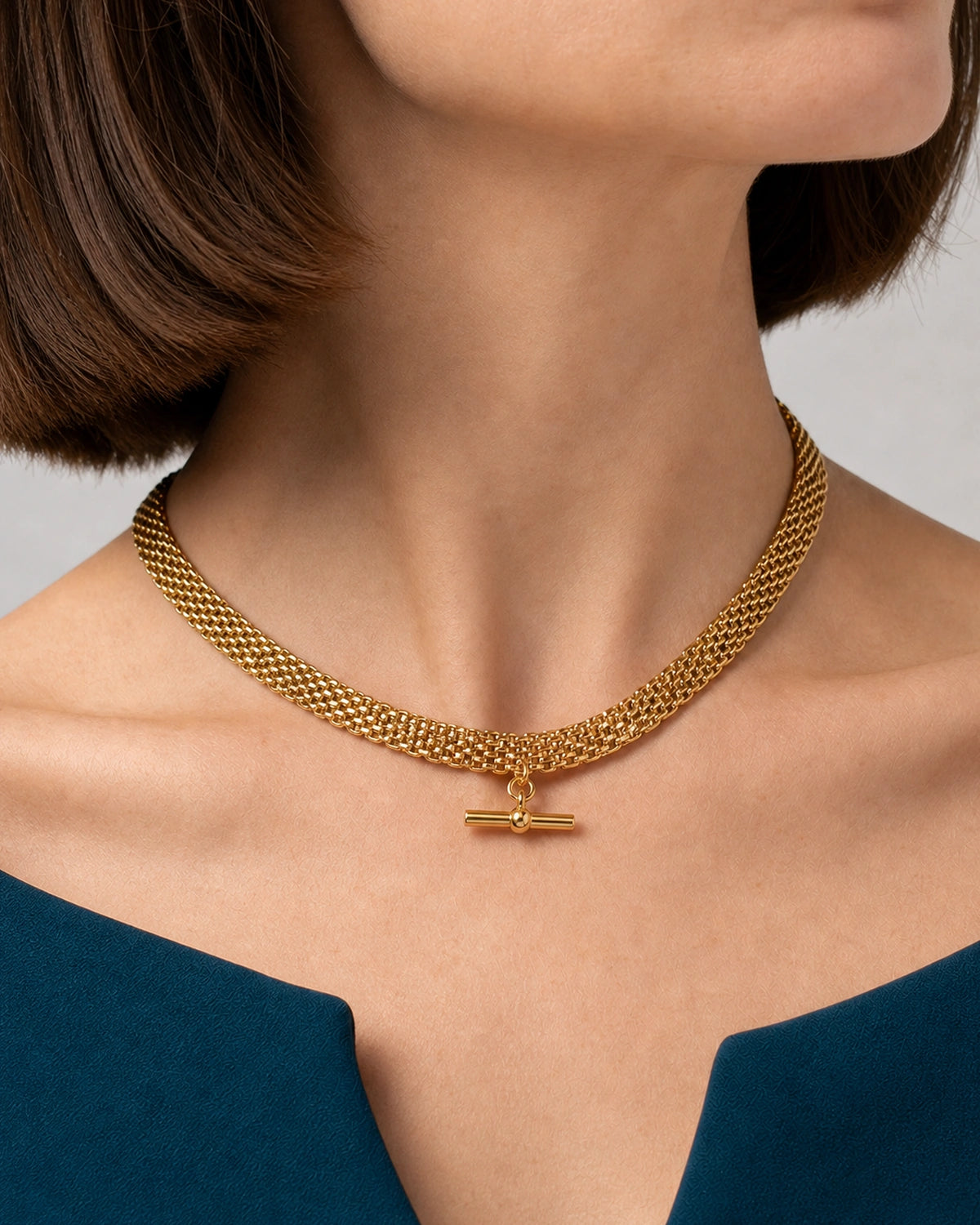 Complete worn macro of the Camille five-row collar and polished T-bar
