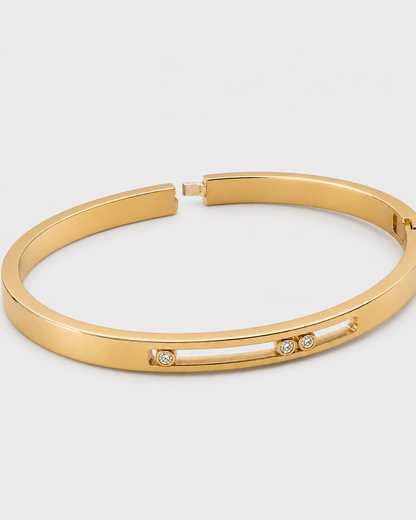 Open hinge and tongue closure view of the Celene three-crystal bangle