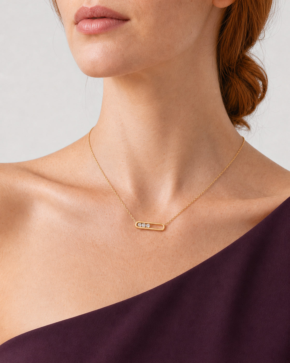 Three-quarter mouth-down view of Georgia wearing the Celene crystal-bar necklace
