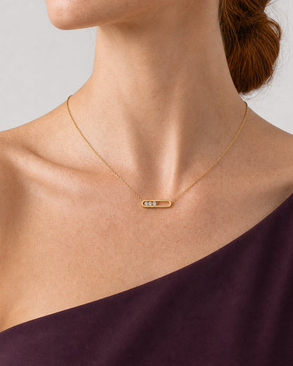 Tight side-neckline detail of the Celene gold floating-crystal bar necklace