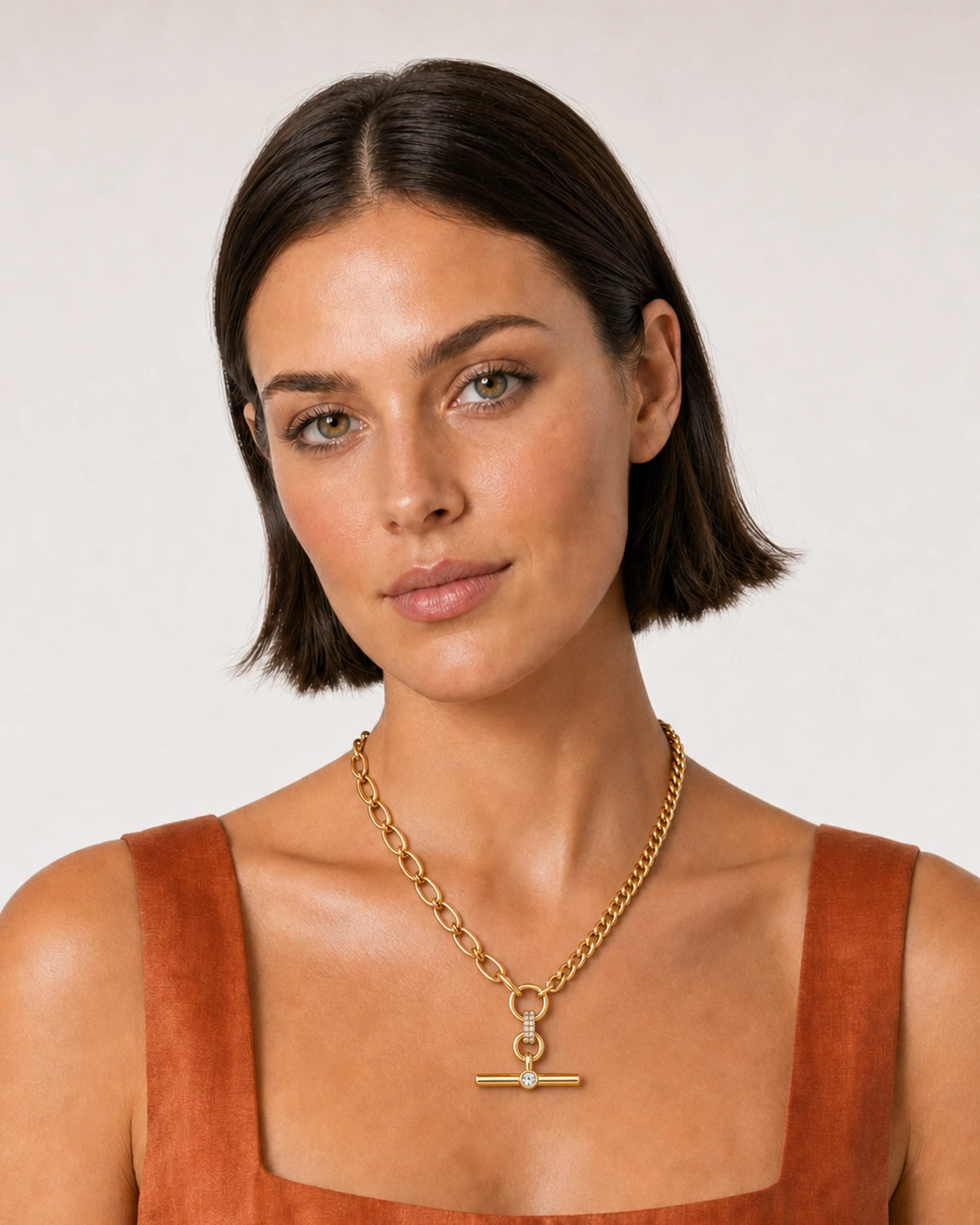Australian model in a terracotta summer dress wearing the Célestine necklace