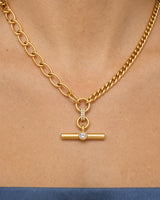 Complete worn macro of the Célestine mixed-link crystal T-bar necklace on Florence