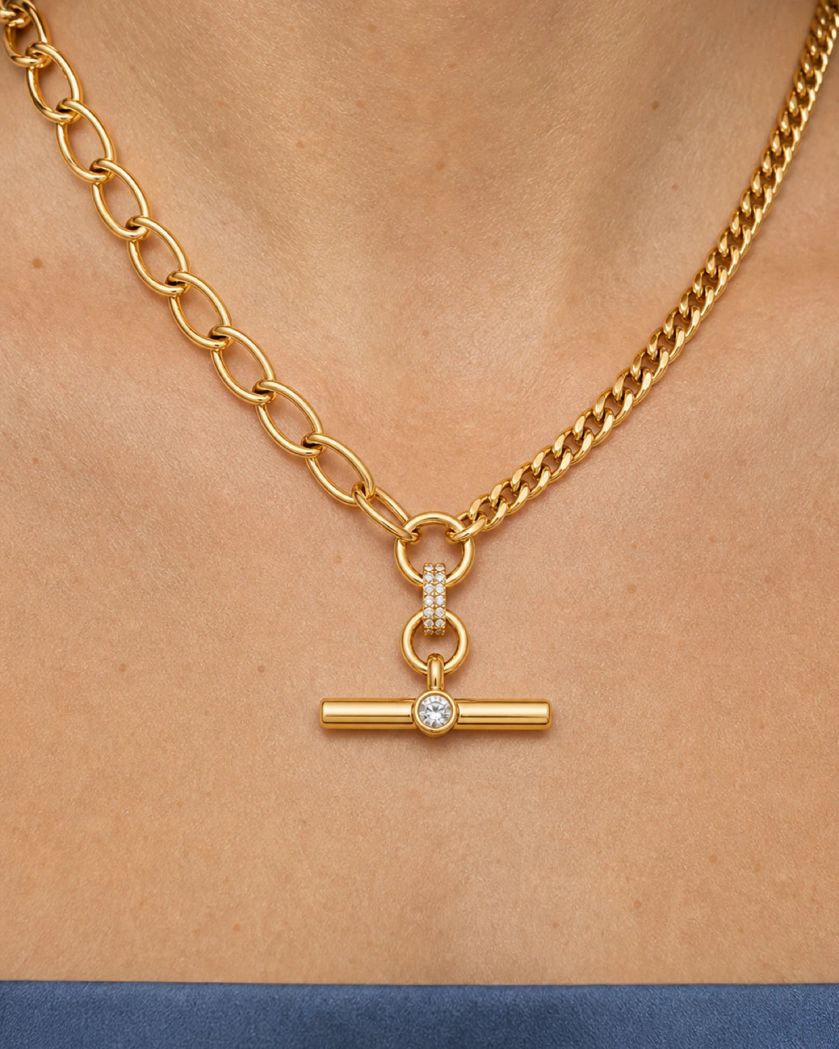 Complete worn macro of the Célestine mixed-link crystal T-bar necklace on Florence