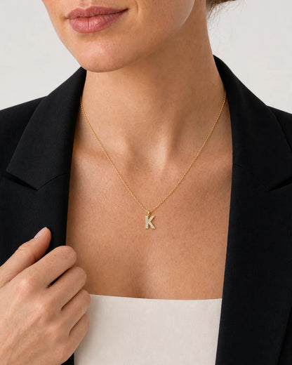 Clean neckline close-up of the Ciel upright clear-pavé K pendant