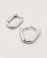 Closed and open construction view of the Clea silver hinged huggies