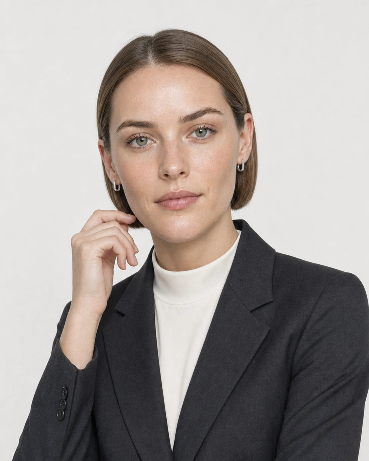 Human-scale studio view of the Clea huggies with charcoal-black tailoring