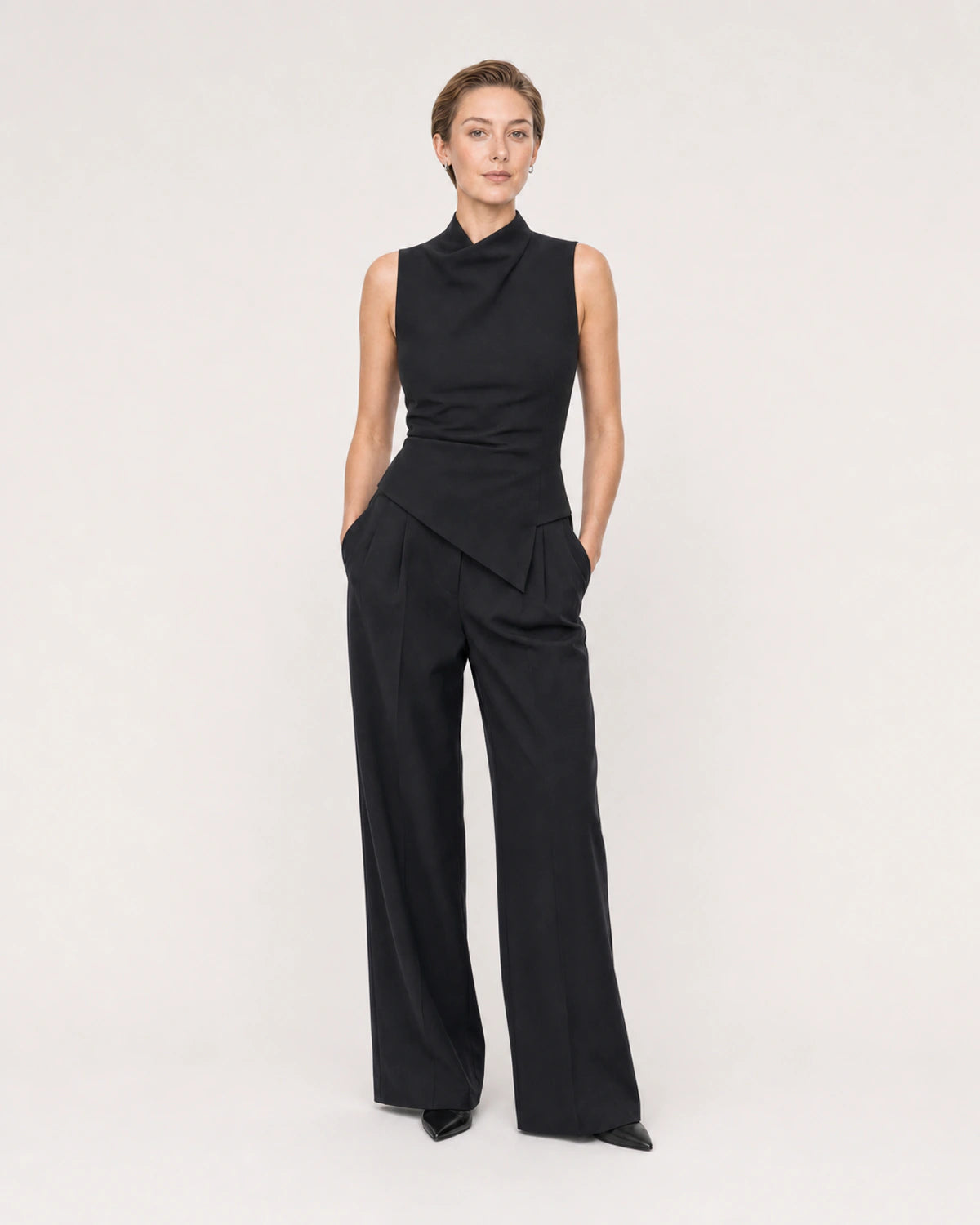 Wide studio portrait showing the Clea silver huggies at natural scale