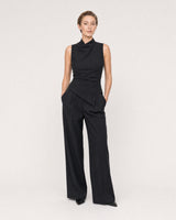 Wide studio portrait showing the Clea silver huggies at natural scale