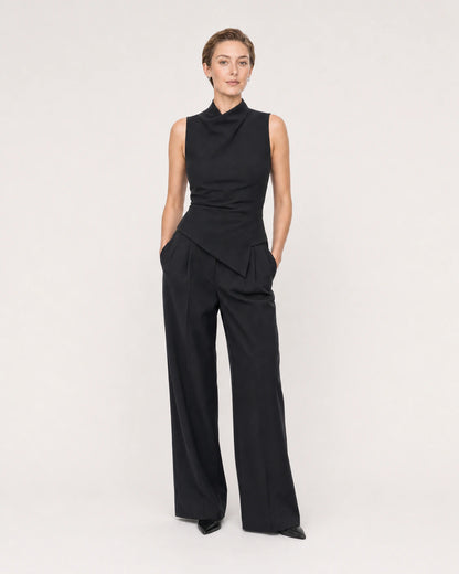 Wide studio portrait showing the Clea silver huggies at natural scale