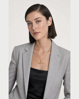 Three-quarter studio portrait featuring the Delphine pavé necklace
