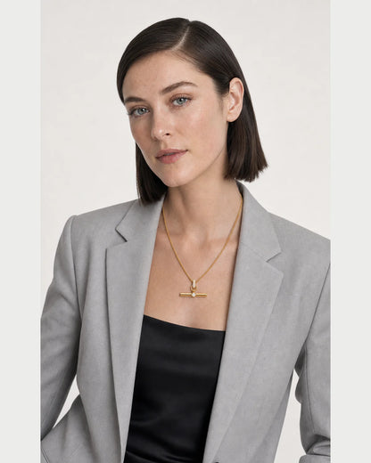 Three-quarter studio portrait featuring the Delphine pavé necklace