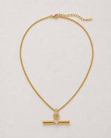Delphine gold pavé toggle necklace on seamless pale neutral grey