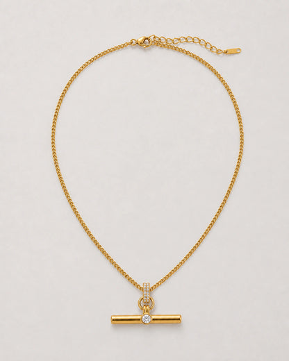 Delphine gold pavé toggle necklace on seamless pale neutral grey