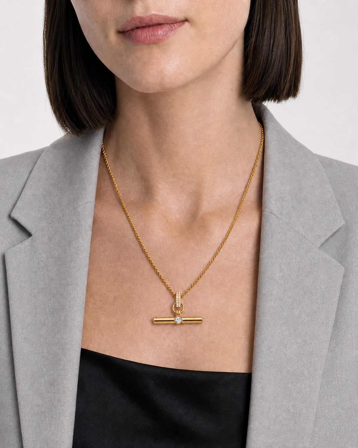 Clean neckline close-up showing the scale and detail of the Delphine necklace