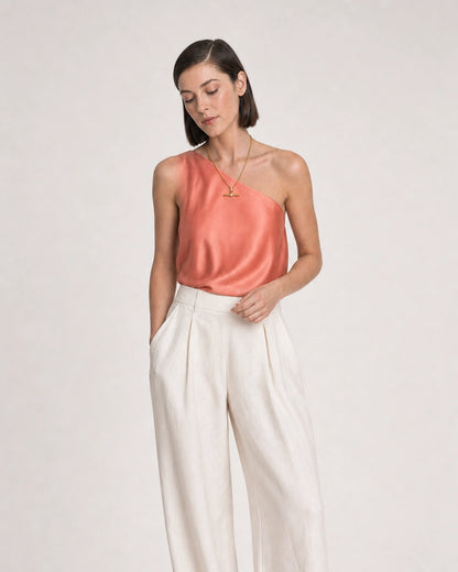 Human-scale summer portrait showing the Delphine pavé toggle necklace