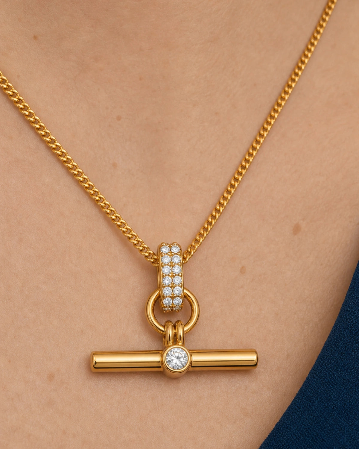 Complete worn macro of Beatrice wearing the Delphine pavé toggle necklace