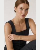 Australian model aged 26 to 29 wearing the Elara mama charm bracelet