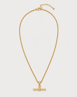 Elodie gold rope T-bar necklace on seamless pale neutral grey