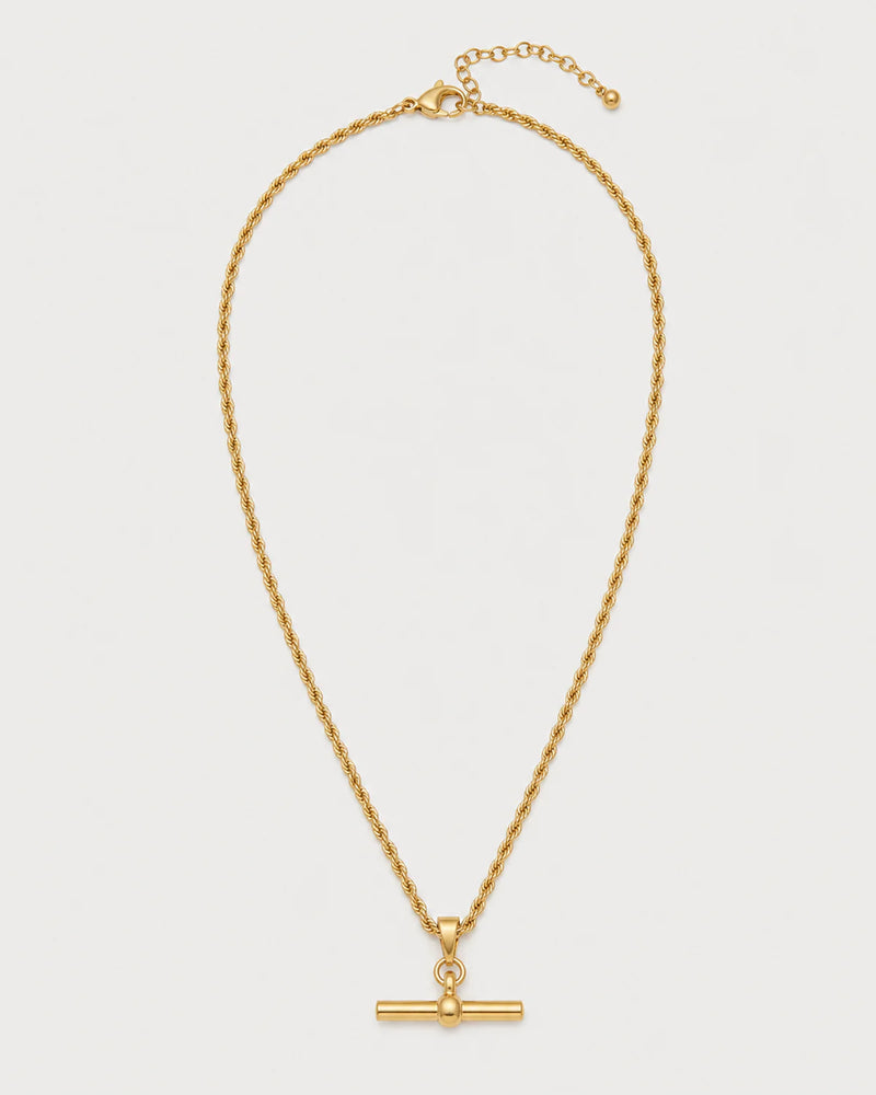 Elodie gold rope T-bar necklace on a pale dove-grey background