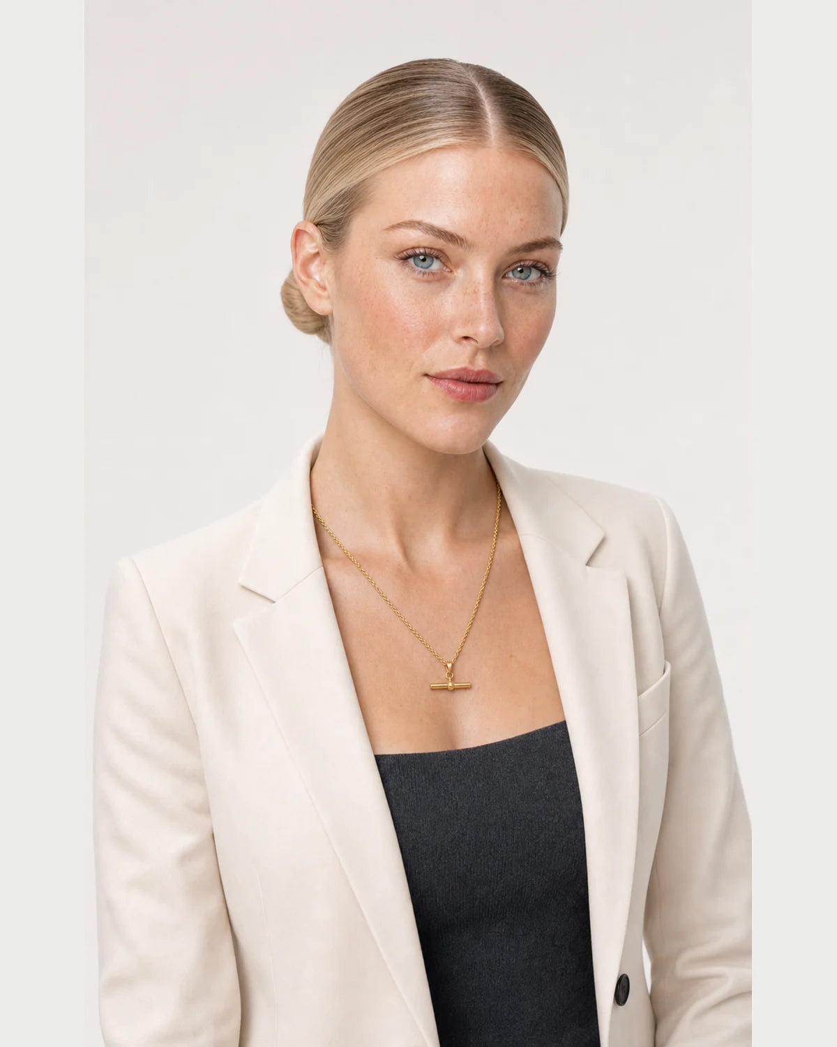 Three-quarter studio portrait featuring the Elodie gold rope necklace