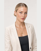 Three-quarter studio portrait featuring the Elodie gold rope necklace