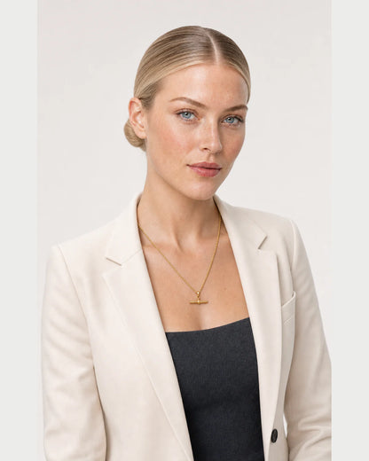 Three-quarter studio portrait featuring the Elodie gold rope necklace