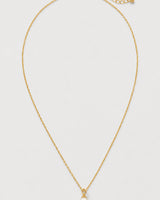 Elowen gold freshwater pearl drop necklace on pale dove-grey