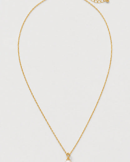 Elowen gold freshwater pearl drop necklace on pale dove-grey