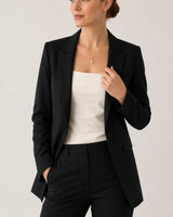 Wide grey-studio portrait featuring Elowen pearl drop necklace