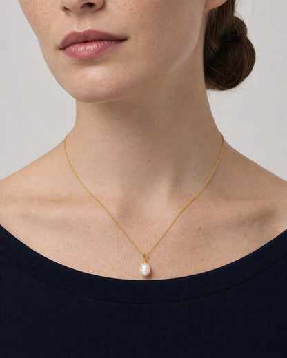 Frontal neckline view of the Elowen gold chain and organic pearl drop necklace