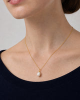 Oblique neckline view of the Elowen organic pearl drop necklace