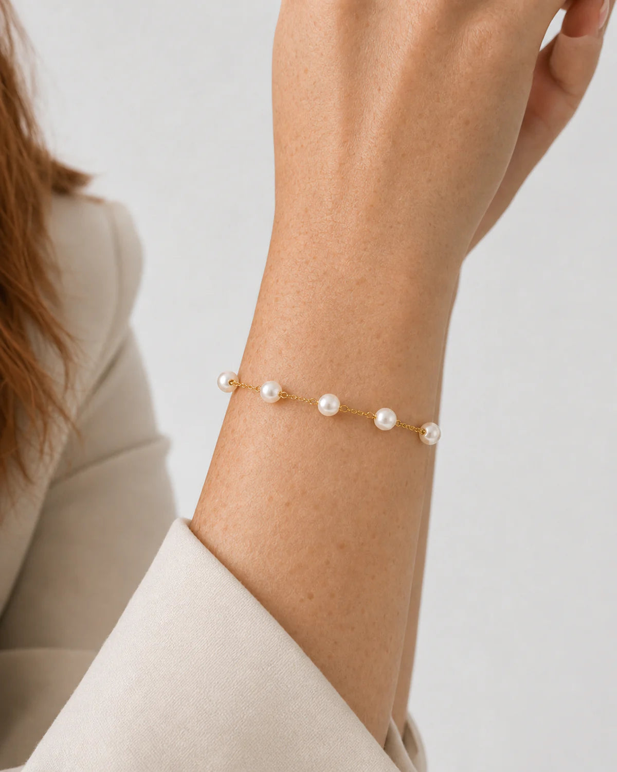 Extreme wrist macro showing all five Elowen pearls