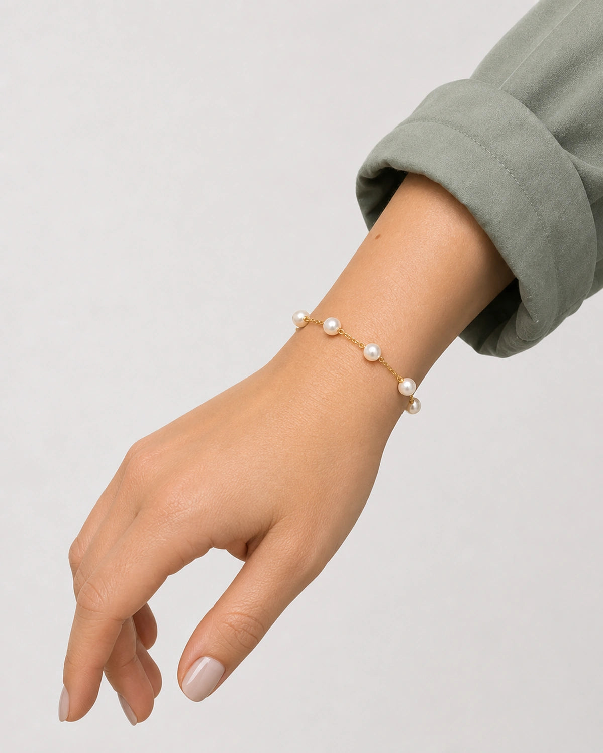 Rotated side-wrist view of the Elowen pearl station bracelet