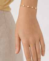 Close wrist view of all five Elowen freshwater pearl stations