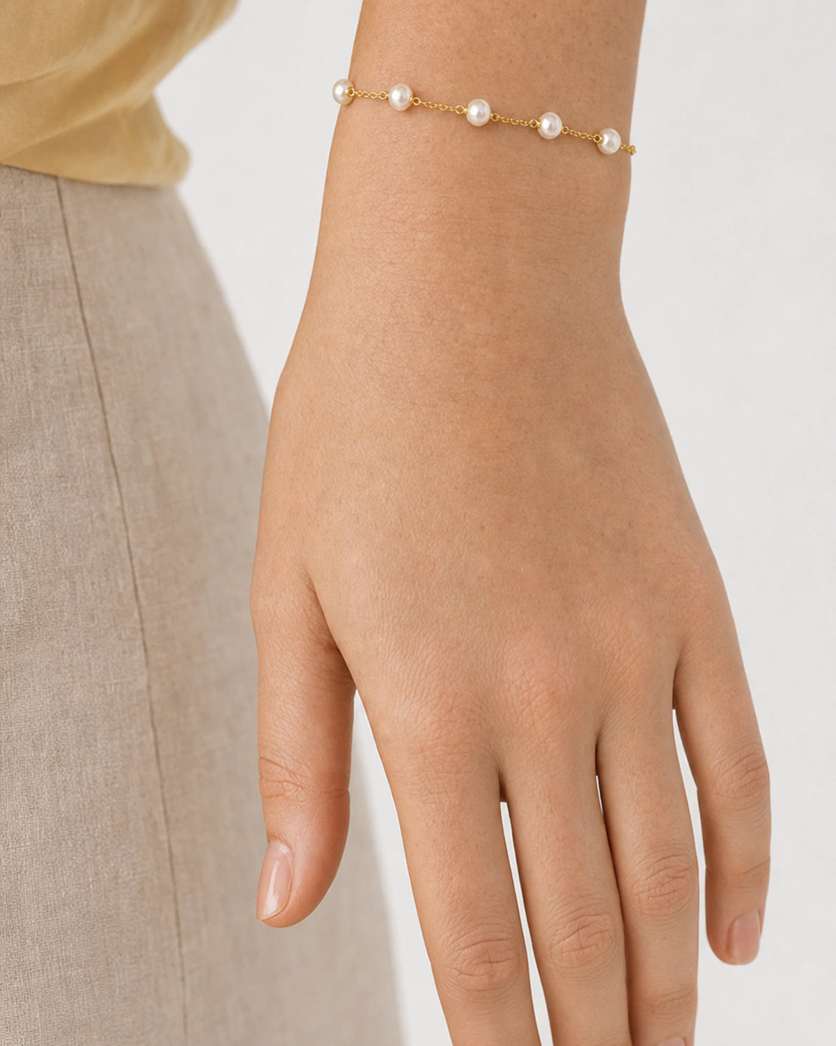 Close wrist view of all five Elowen freshwater pearl stations