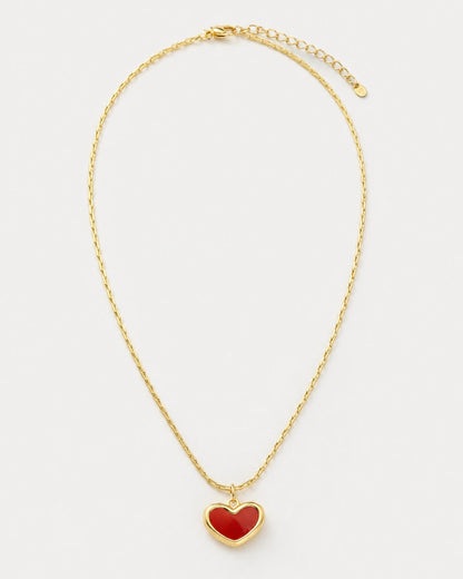Estelle gold red enamel heart necklace on pale dove-grey