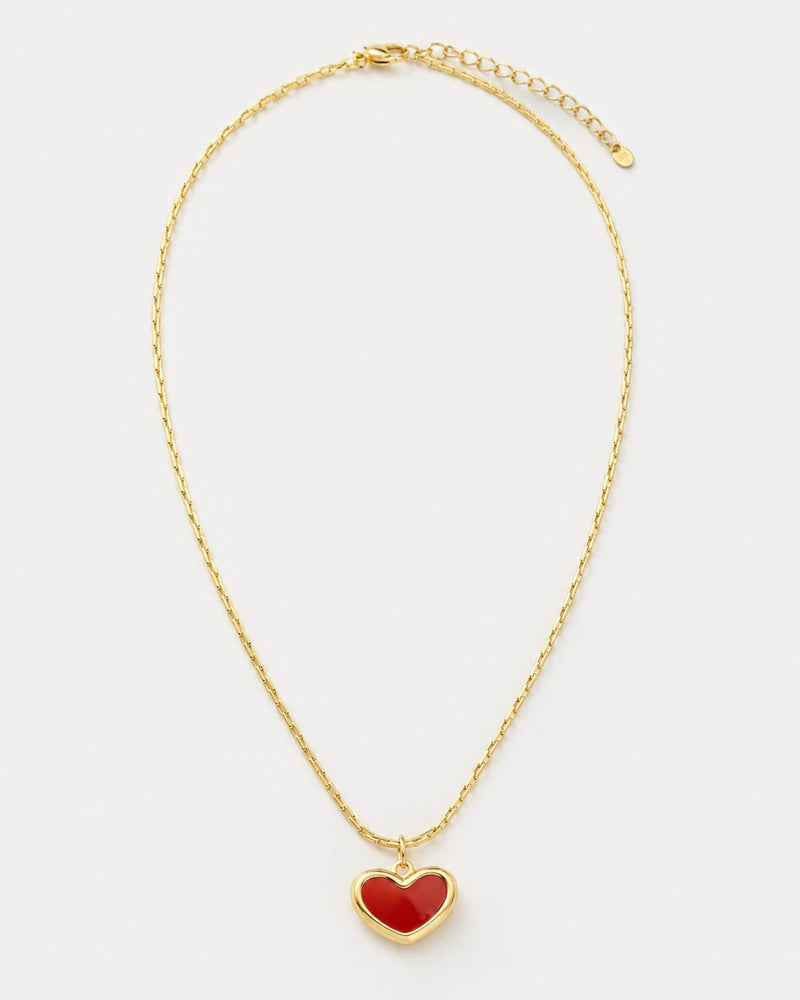 Estelle gold red enamel heart necklace on pale dove-grey
