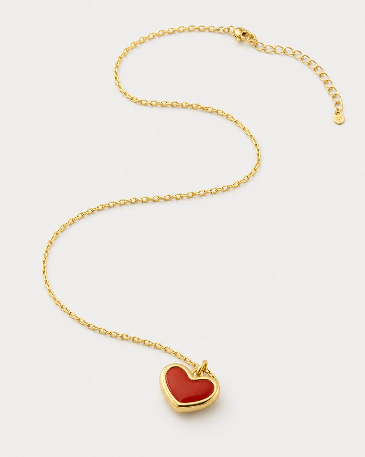 Estelle gold heart necklace in an alternate studio arrangement with clasp visible